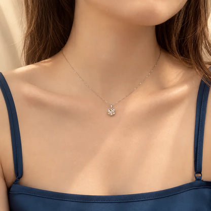 Woman wearing a delicate round moissanite pendant necklace