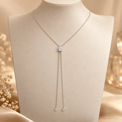 Silver tone pear cut moissanite lariat necklace with delicate hanging chain drops