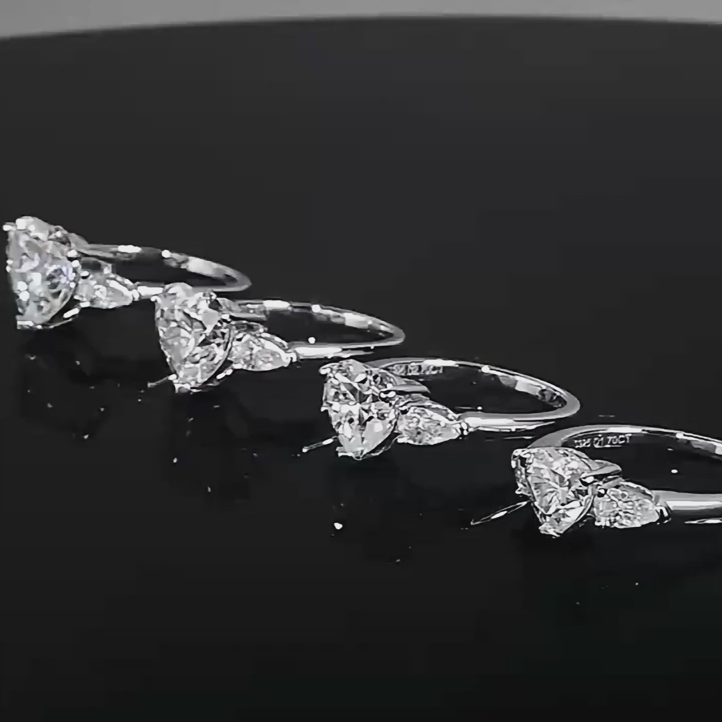 Close-up video of an Eloryva silver ring featuring a heart-shaped center stone with two sparkling side stones.