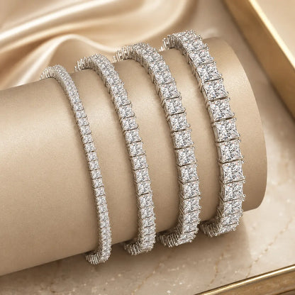 Round moissanite tennis bracelets for women shown in multiple stone widths and sizes on a luxury beige display.