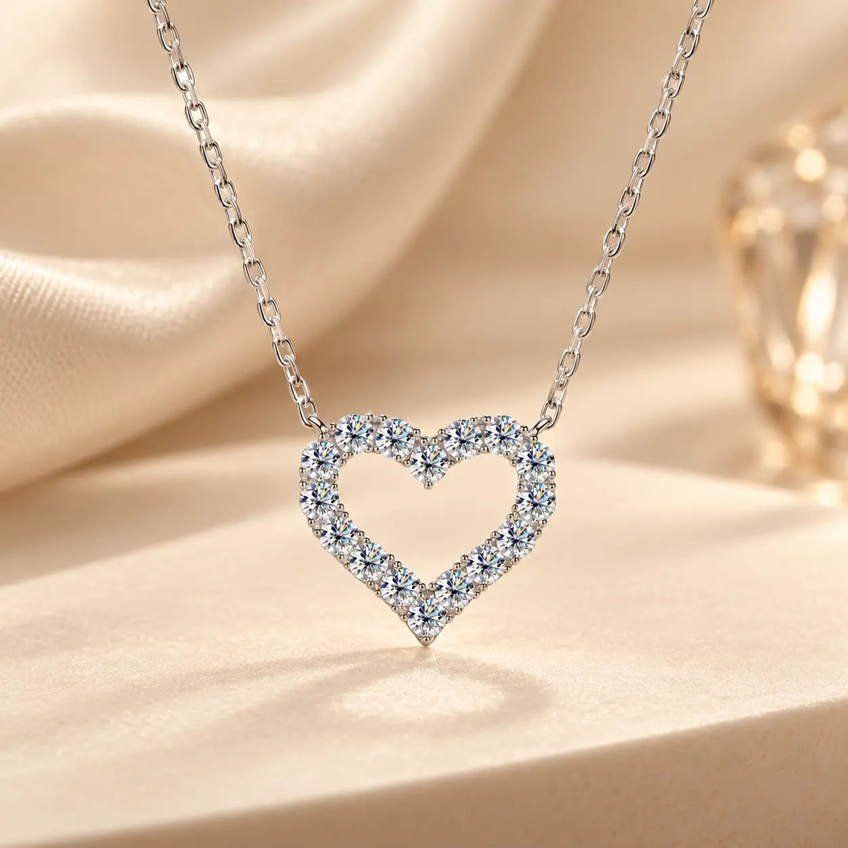 Silver tone open heart moissanite necklace styled in an elegant beige setting