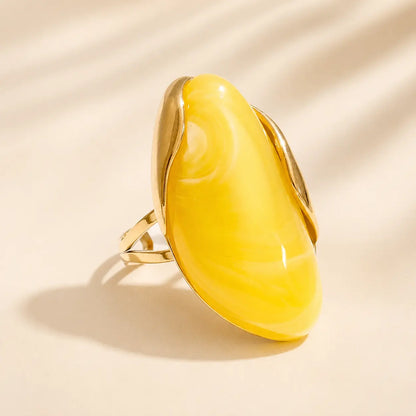 Bright yellow Solenne™ Color Resin Statement Ring for Women with glossy resin and a modern gold-tone setting.
