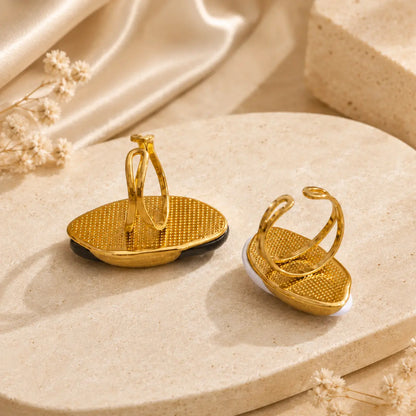 Back view of the Solenne™ resin statement ring for women showing the polished gold-tone adjustable ring setting.
