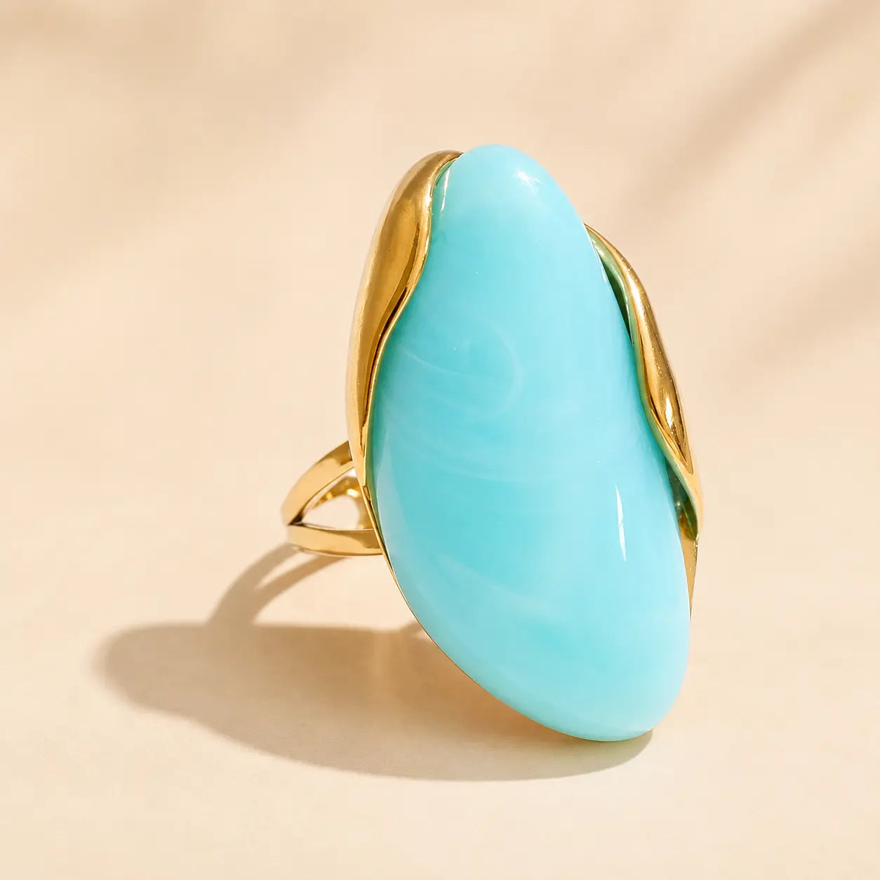 Turquoise Solenne™ resin statement ring for women with smooth glossy resin and elegant gold-tone accents.